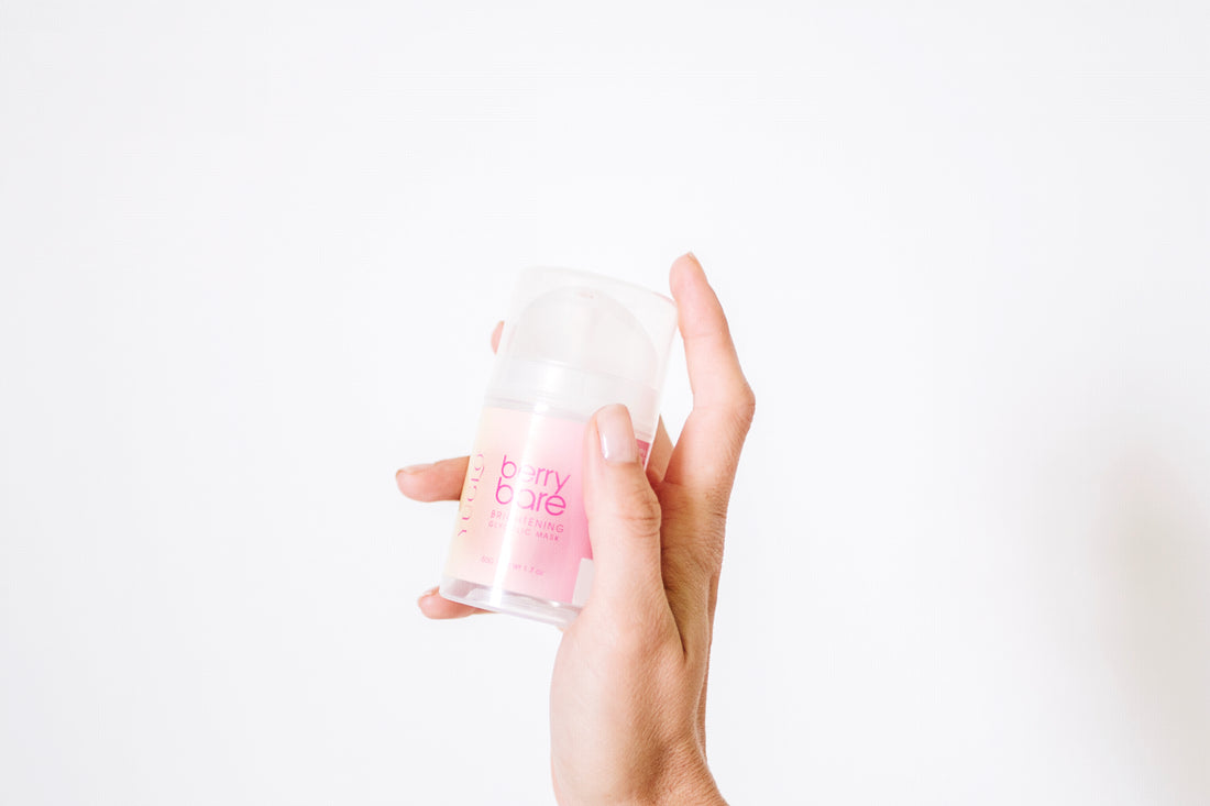 Hand holding up Berry Bare Face Mask