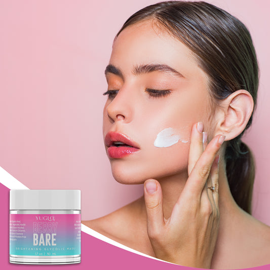 Female showing face mask swatch on cheek and Berry Bare Face Mask Jar