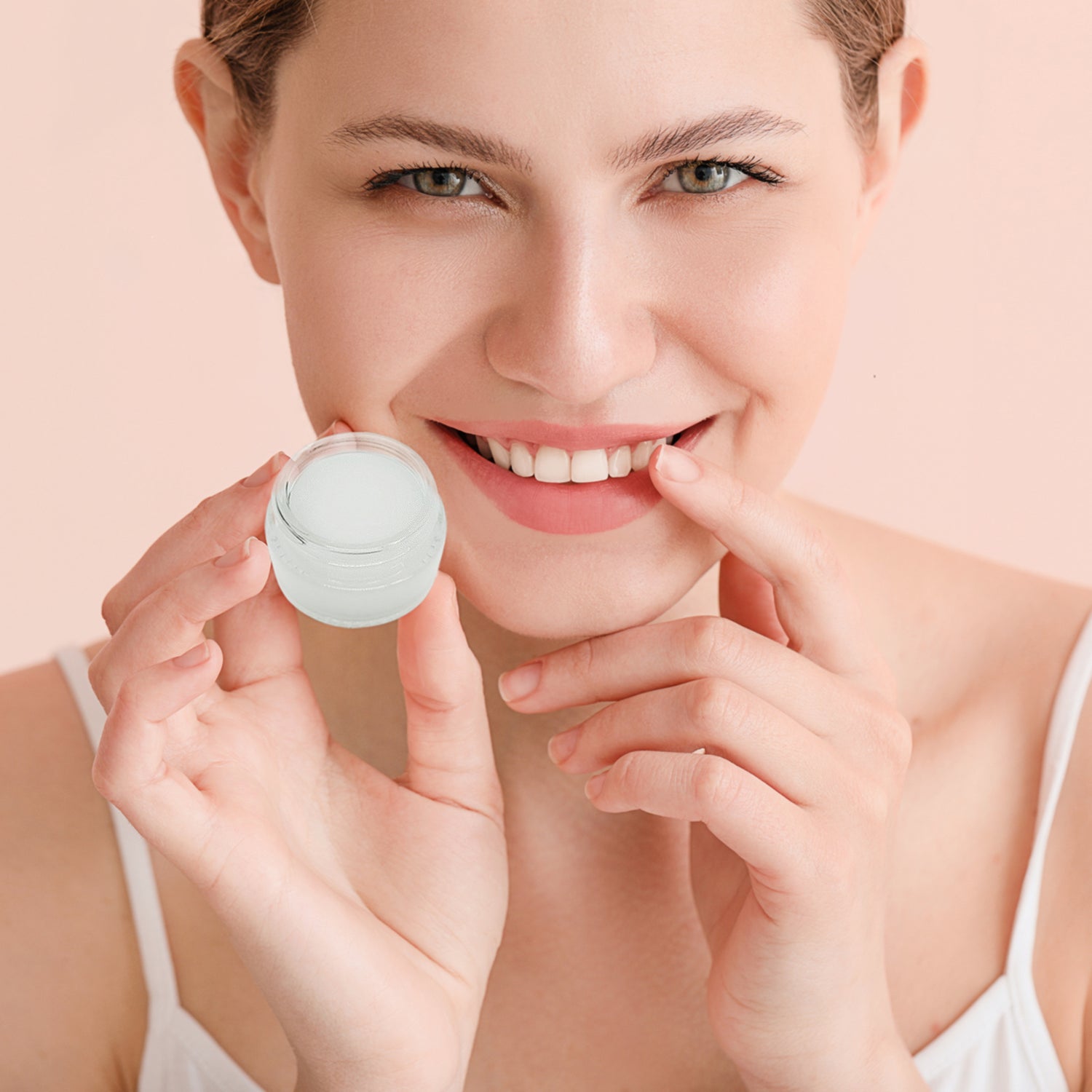 A woman is holding Yuglo's Vanilla Lip Mask - skin product